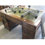 Oak twin pedestal desk with tooled leather inlay and 8 drawers