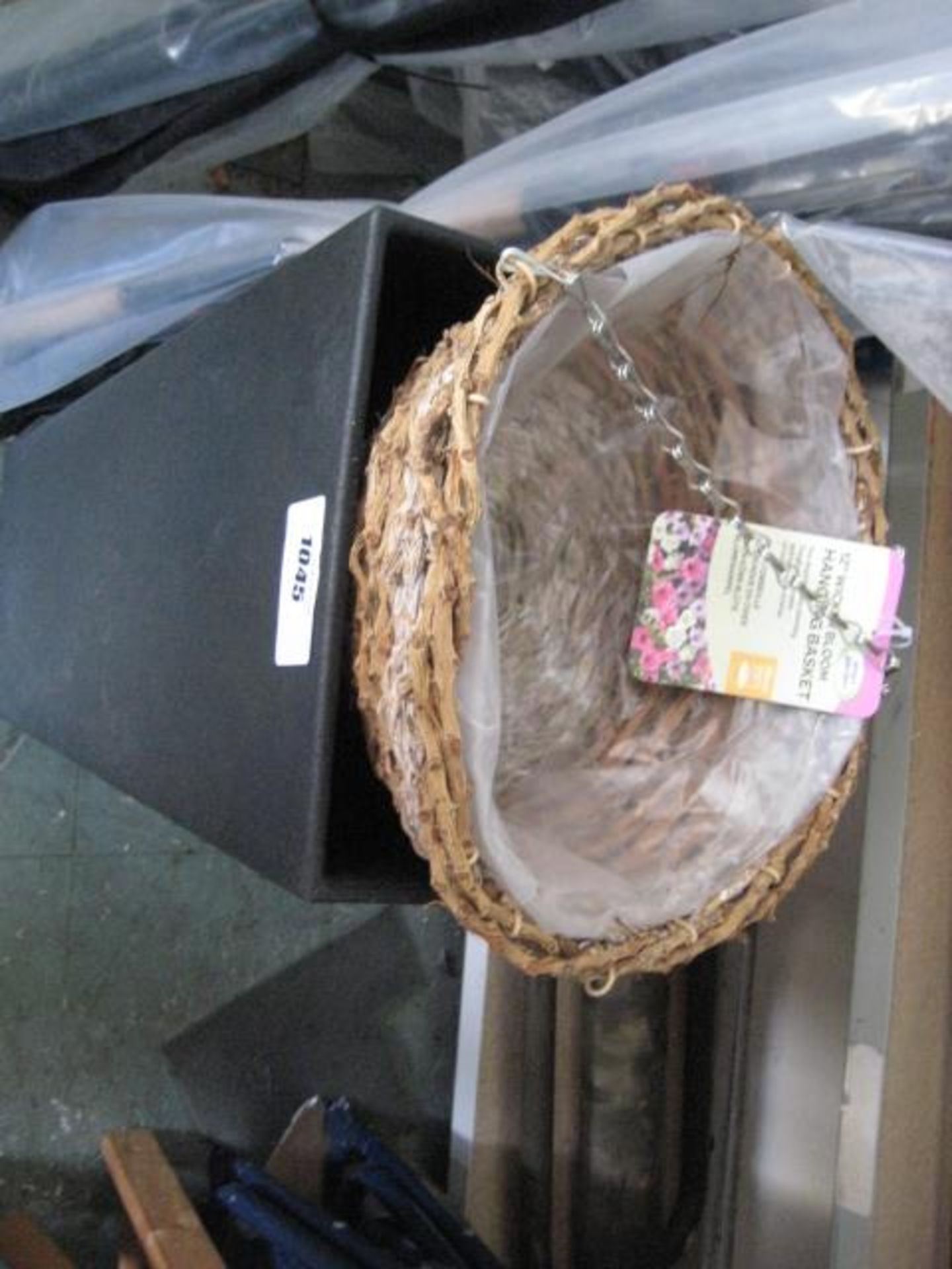 Black plastic planter with 12'' wicker bloom hanging basket