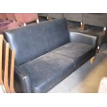 Black contract vinyl upholstered 3 seater sofa on tapered beech supports
