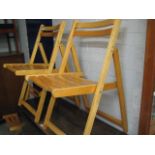 Set of 3 light wood folding chairs