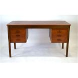 A 1960/70's Danish teak, crossbanded and beech desk, the two pedestals each with three drawers,