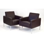 A pair of Walter Knoll brown leather club armchairs with brushed aluminium legs,