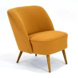 A 1960's German cocktail chair with mustard upholstery and beech tapering legs,