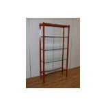 Richard Young for Merrow Associates, a five tier shelving unit with a red steel frame, w.