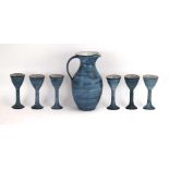 Tessa Fuchs (1936-2012), a blue pottery ewer together with six matching goblets,