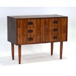 A 1960's Danish rosewood chest of six small drawers, each with turned integral handles,