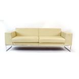 A Boss Design 'Layla' sofa in cream leather with a chromed frame, l.