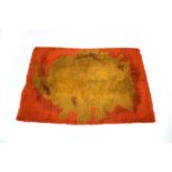 A 1960/70's woolen rug, the red ground with a stylised gold creature,