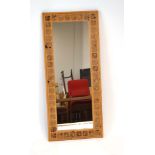 A 1979 Swedish mirror of rectangular form with a pine and burr pine frame, designed by H.