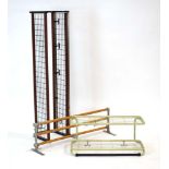 Three 1960's wall-mounted cage-type shelves with coat/hat hooks,