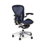 Don Chadwick and Bill Stumpf for Herman Miller, an Aeron desk chair with blue tinted seat and back,