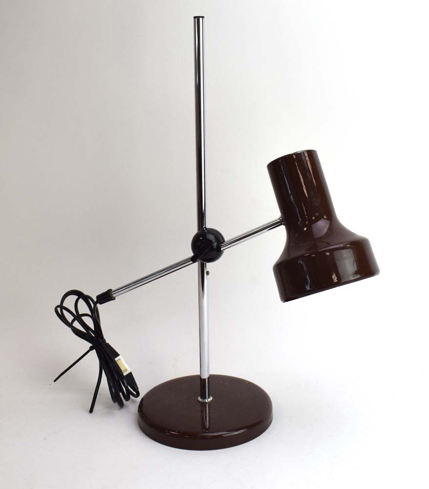A 1970's brown enamelled desk lamp with an adjustable shade on an aluminium shaft