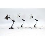 A set of three Lloydtron adjustable desk lamps