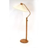 A 1960/70's pine standard lamp with a fabric shade CONDITION REPORT: Working order
