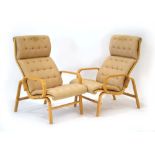 A pair of 1983 Swedish beech bentwood armchairs with pale grey button upholstered seats,