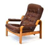 A Gote Mobler brown leather and button upholstered adjustable lounge armchair with a bentwood frame