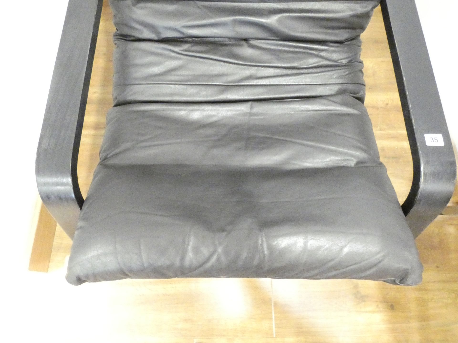 A 1970's armchair, the leather cushion on a black ash bentwood frame, in the manner of Alvar Aalto, - Image 3 of 10
