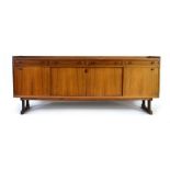 A 1960's Danish rosewood sideboard, the four drawers will turned handles over four sliding doors,