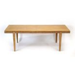 A 1960/70's oak occasional table of rectangular form with angular tapering legs, l.