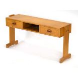 A 1960/70's pine side/console table with two drawers and a gallery section, on T-shaped sides, l.