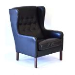 A 1960's Danish black leather wingback armchair on square chamfered legs *Sold Subject to our