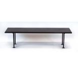 A 1950/60's occasional table, the slate surface resting on a fitted black metalwork base, l.