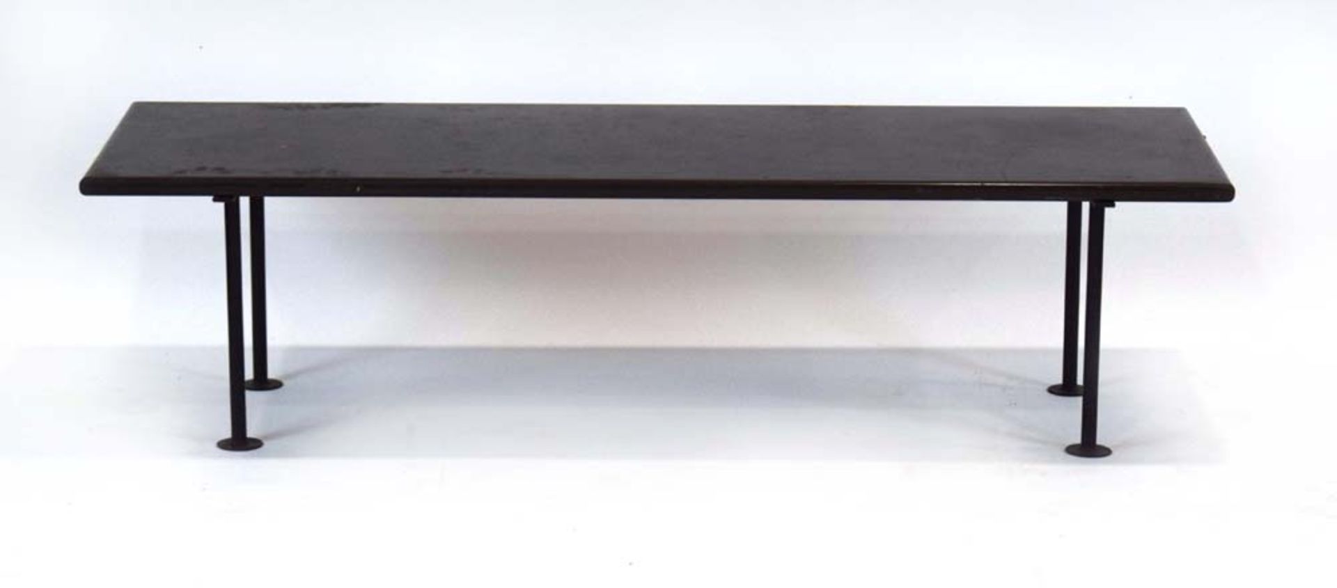A 1950/60's occasional table, the slate surface resting on a fitted black metalwork base, l.