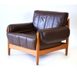 A 1960/70's Danish teak armchair with brown leather upholstery,