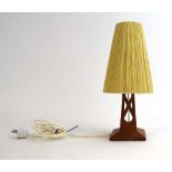 A 1960's Swedish table lamp with a sculptural teak body and a spun shade CONDITION