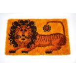 A 1970's Danish Rya rug, the golden ground decorated with a lion,