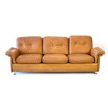 A 1980's Skippers Mobler three-seater tan leather and button upholstered sofa *Sold Subject to