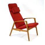 A 1970's Swedish adjustable armchair, the single-part seat and headrest on a frame of organic form,