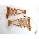 A pair of Scandinavian pine scissor arm wall lights