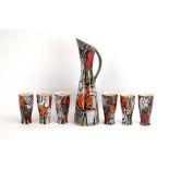 A French studio pottery ewer together with six matching goblets, each decorated in coloured enamels,
