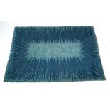 A 1960/70's Axminster woolen rug with a blue-to-grey ground,