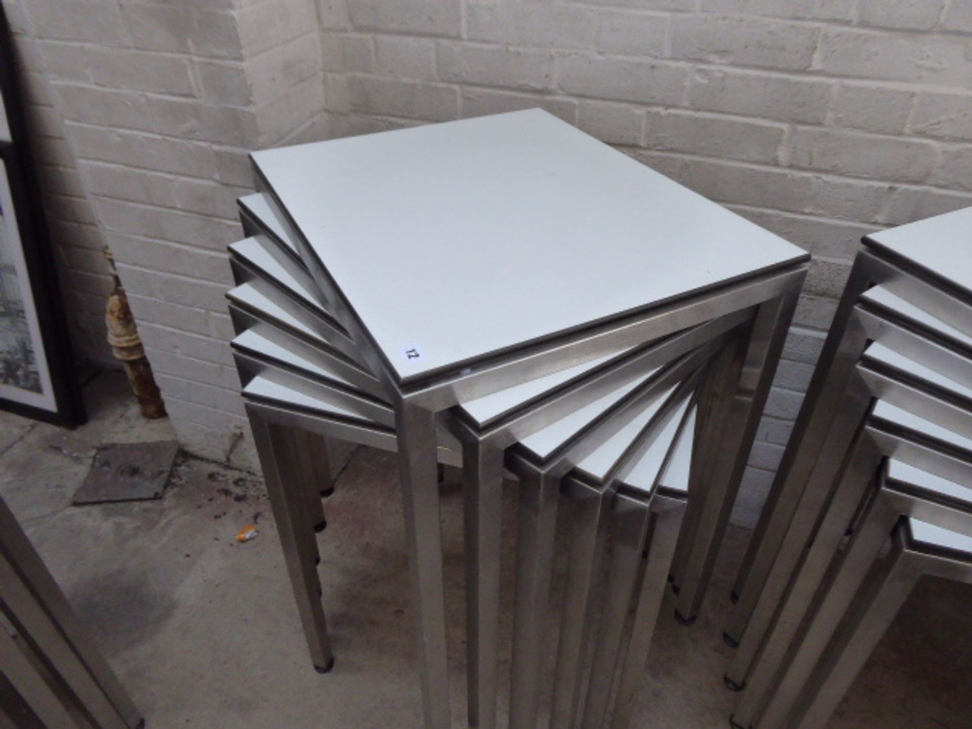 Stack of 6 stainless steel and white top 60cm x 50cm rectangular stackable tables suitable for