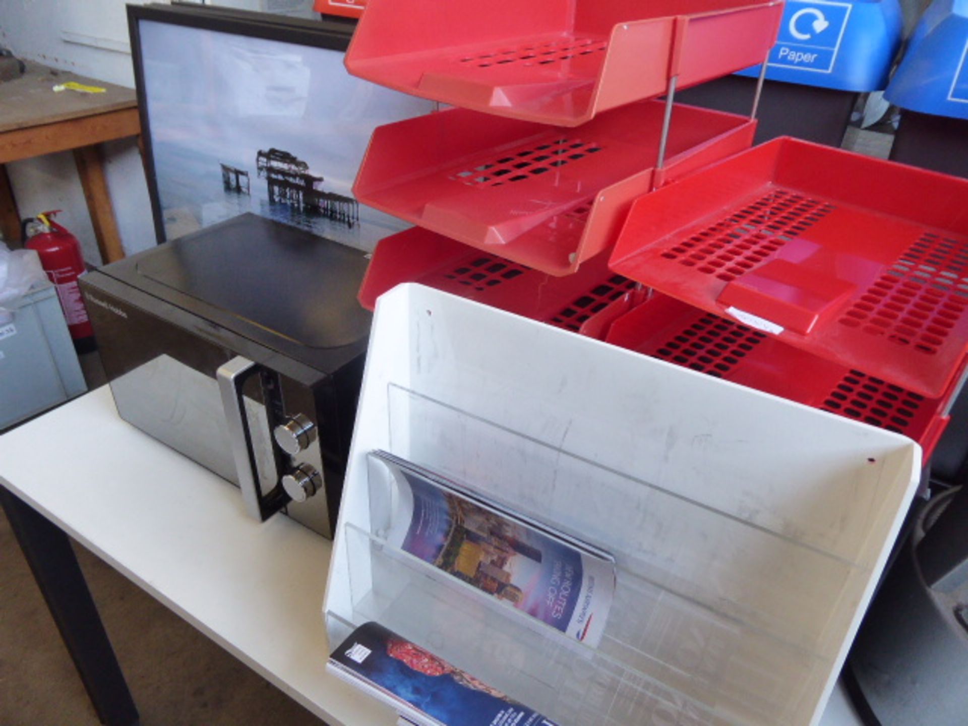 Table top of assorted items including paper guillotines, paper trays, domestic microwave, framed and - Image 3 of 3