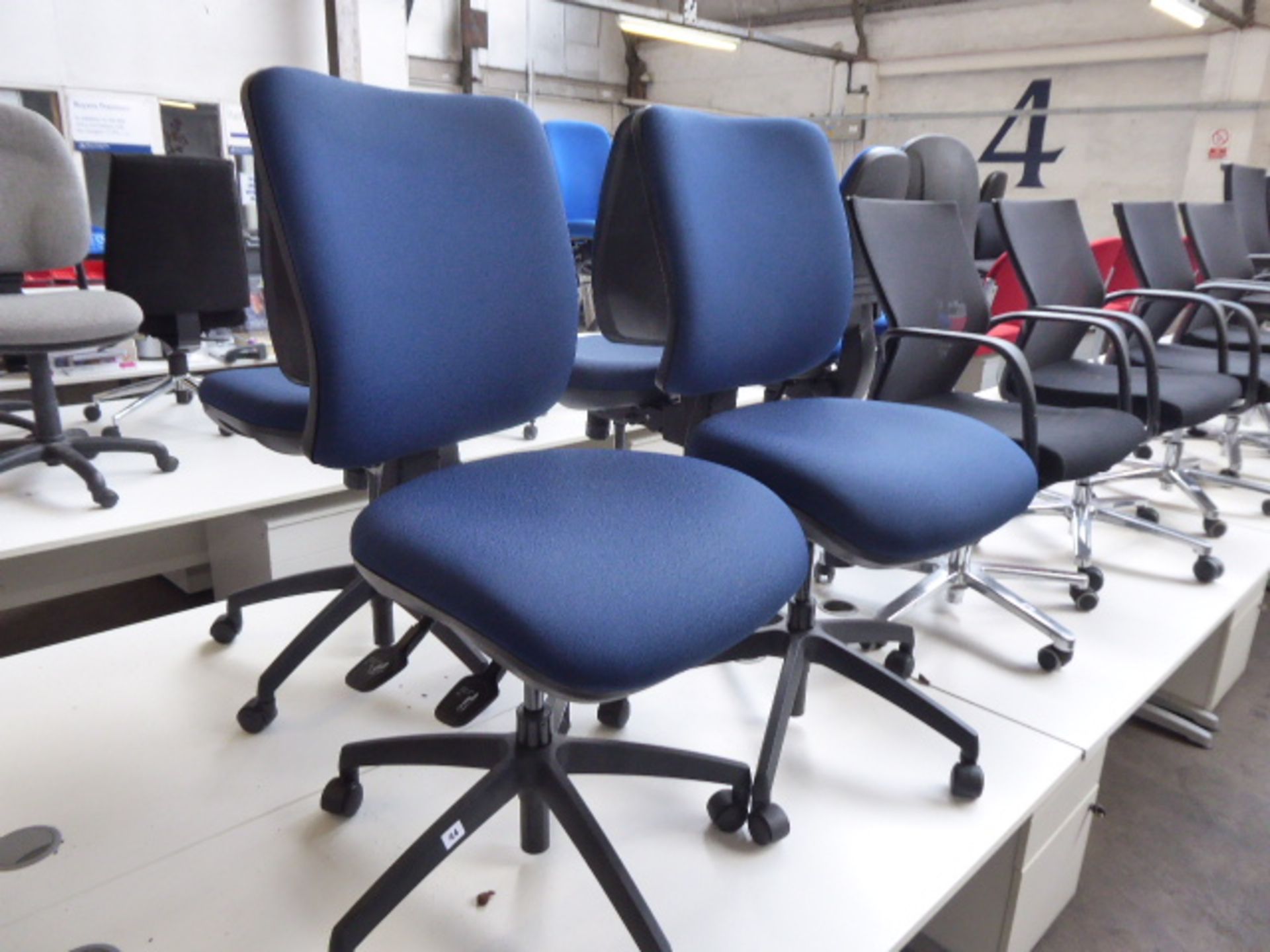 2 Dark blue swivel operators chairs