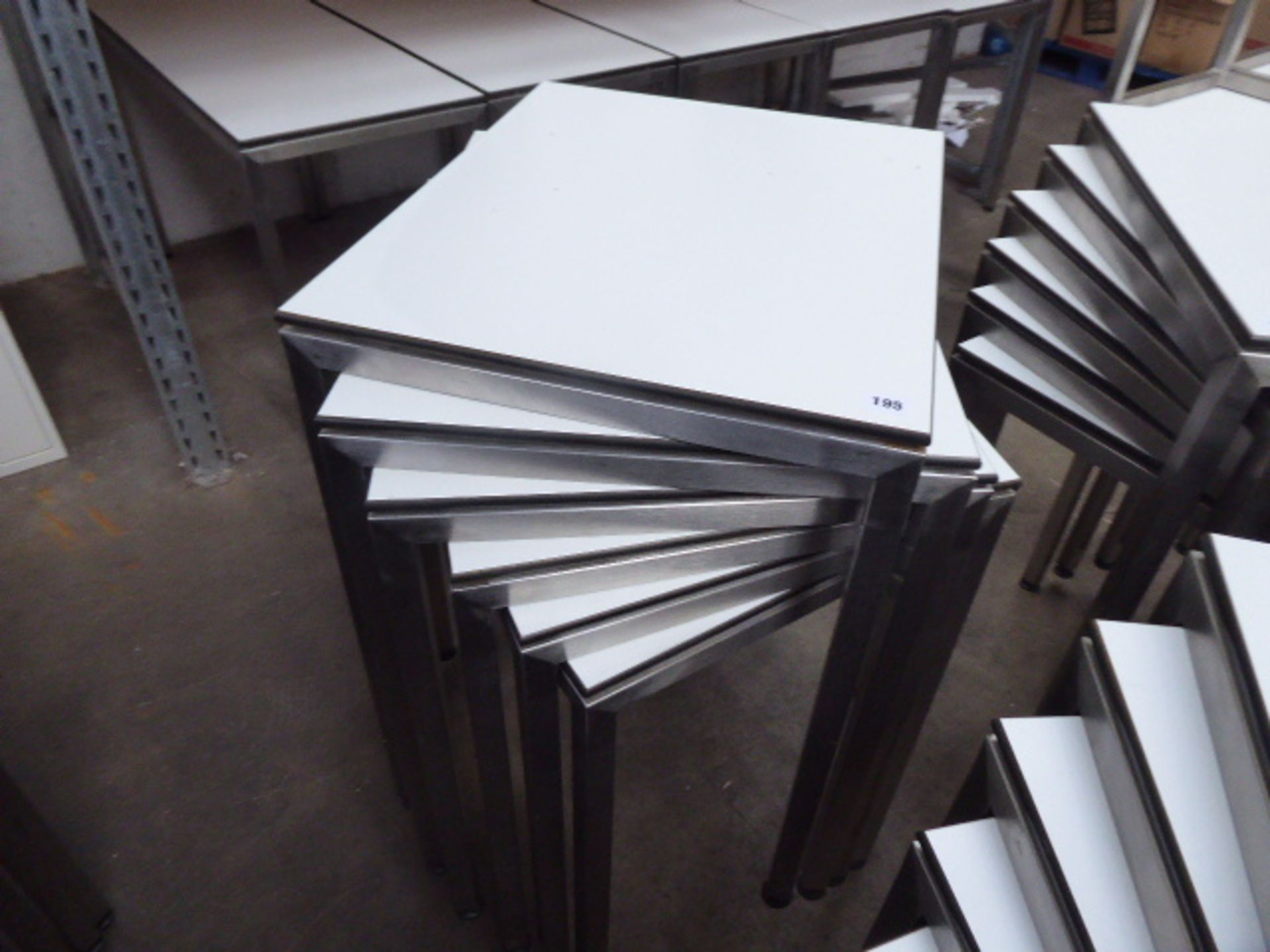 Stack of 6 stainless steel and white top 60cm x 50cm rectangular stackable tables suitable for