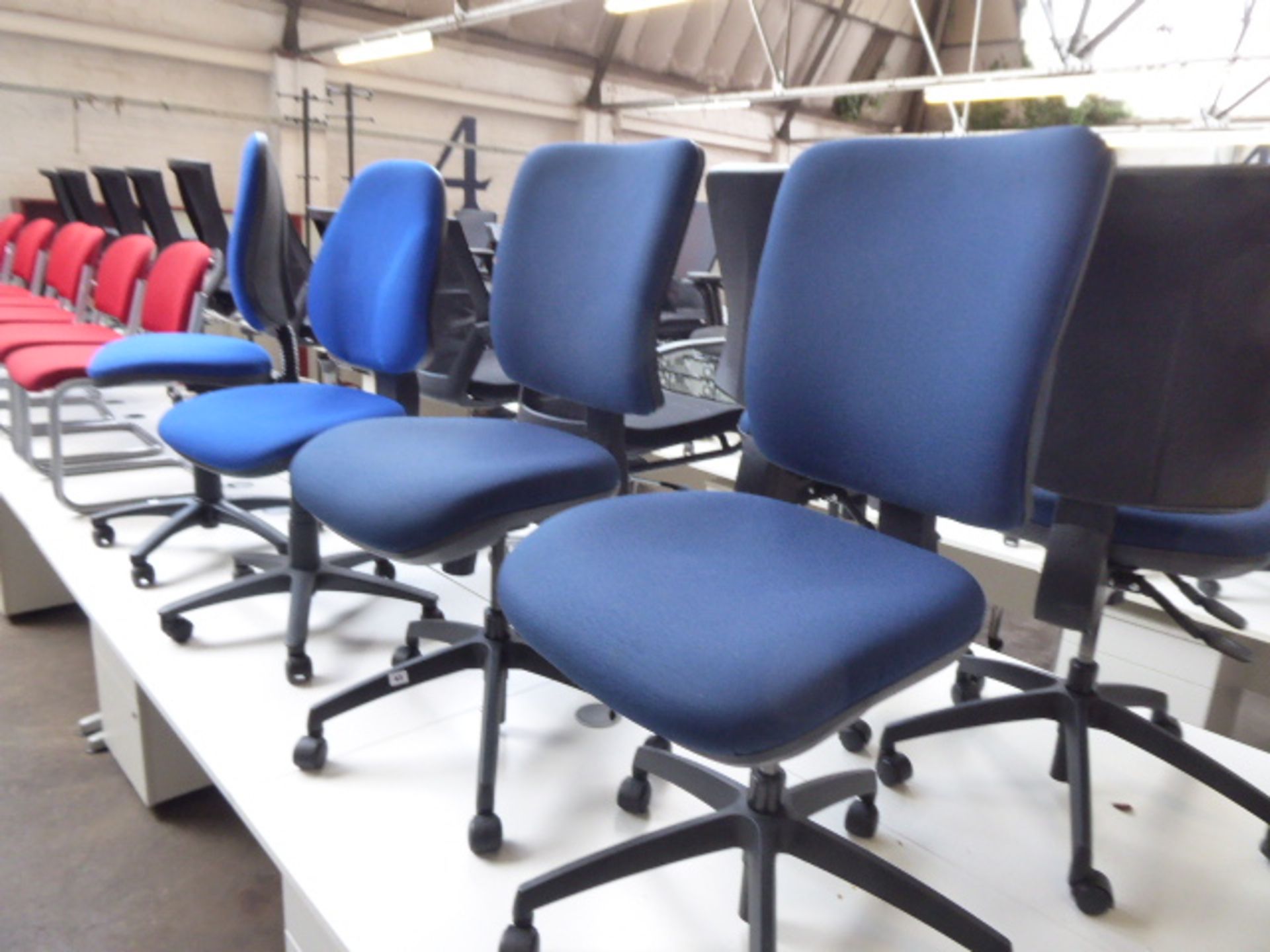 2 Dark blue swivel operators chairs