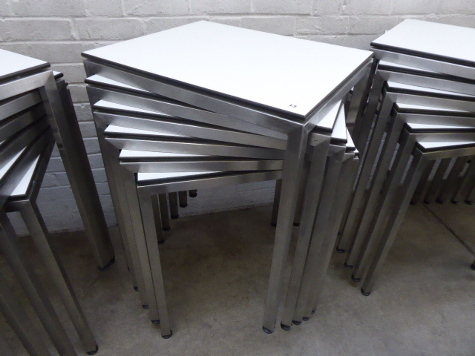 Stack of 6 stainless steel and white top 60cm x 50cm rectangular stackable tables suitable for