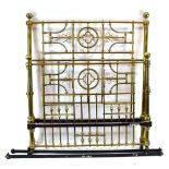 A Victorian brass bedstead of Gothic design, w. 150 cm (interior), l. 203.