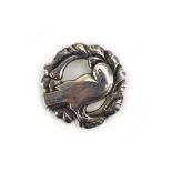 A mid-20th century silver wreath brooch by Georg Jensen, centrally decorated with a stylised dove,