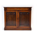 A Victorian rosewood side cabinet, the rosewood surface over two doors on a plinth base, w.