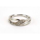 A 9ct white gold crossover ring set small diamonds, ring size N, 2.