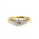 An 18ct yellow gold and platinum highlighted ring set brilliant cut diamond in an eight claw