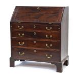 A Georgian mahogany bureau, the fall front over two short and three long graduated drawers,