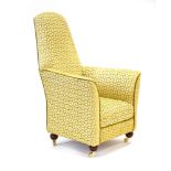 An early 20th century Scandinavian highback rocking armchair upholstered in gold damask upholstery