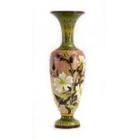 A late 19th century Doulton Lambeth Slaters bottle vase of slender ovoid form decorated with floral