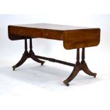A Regency mahogany and tulipwood crossbanded sofa table inlaid with boxwood and ebonised lines,
